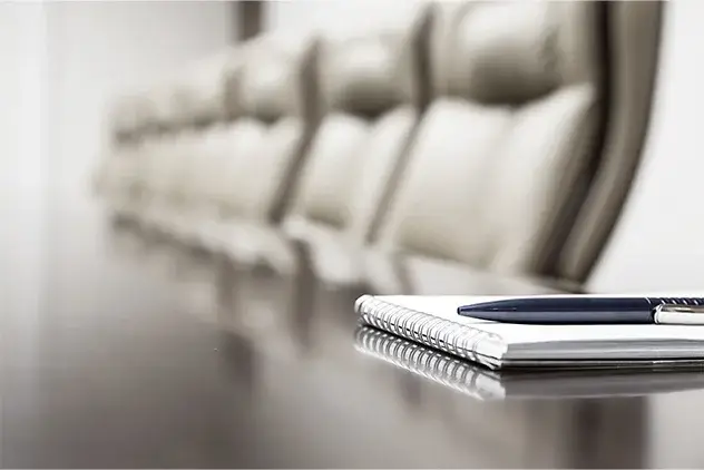 close up of notebook in board room