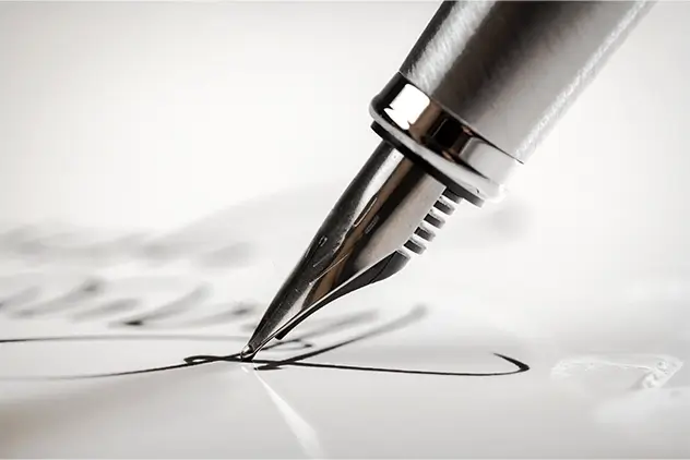 close up of pen signing legislation