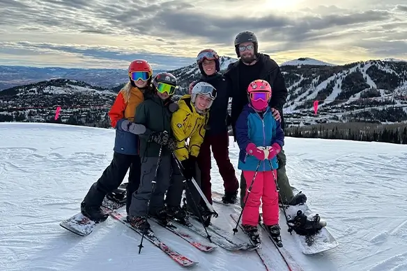 rich jones and his family pose while skiing
