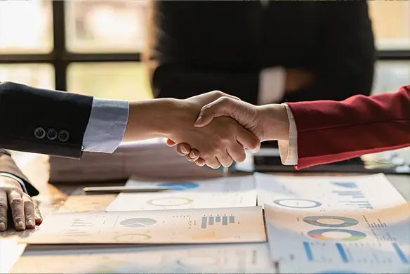 m&a professionals shake hands
