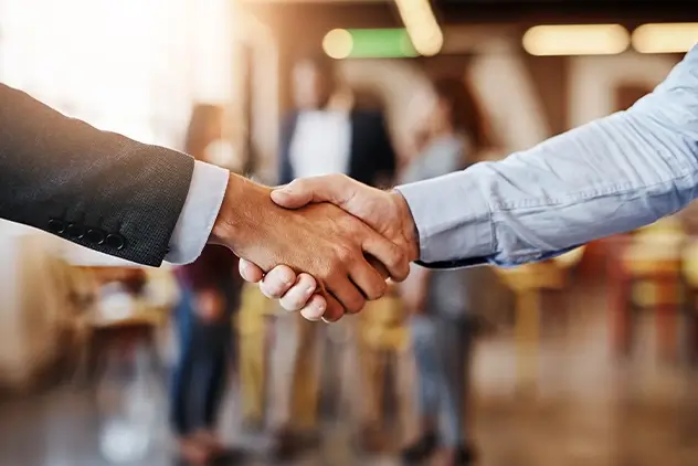 business advisor shaking hands at a conference