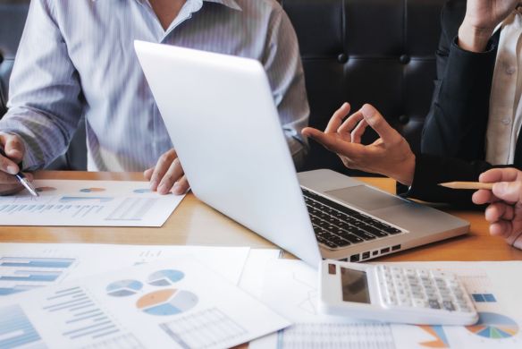 advisor reviewing M&A report for specific industry
