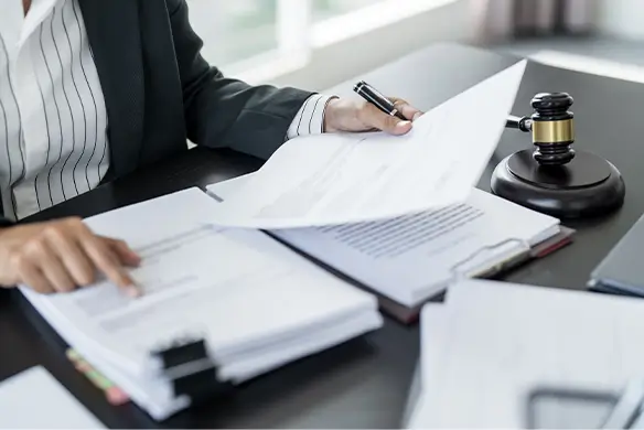 person looking over buy-sell agreement